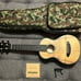 Standard size Breedlove ukulele. Kala capo. Nylon strings. Camo bag.