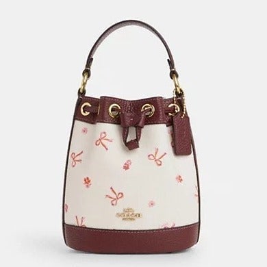 Coach CN707  Dempsey Drawstring Bucket Bag 15 With Bow Print (Firm Price)