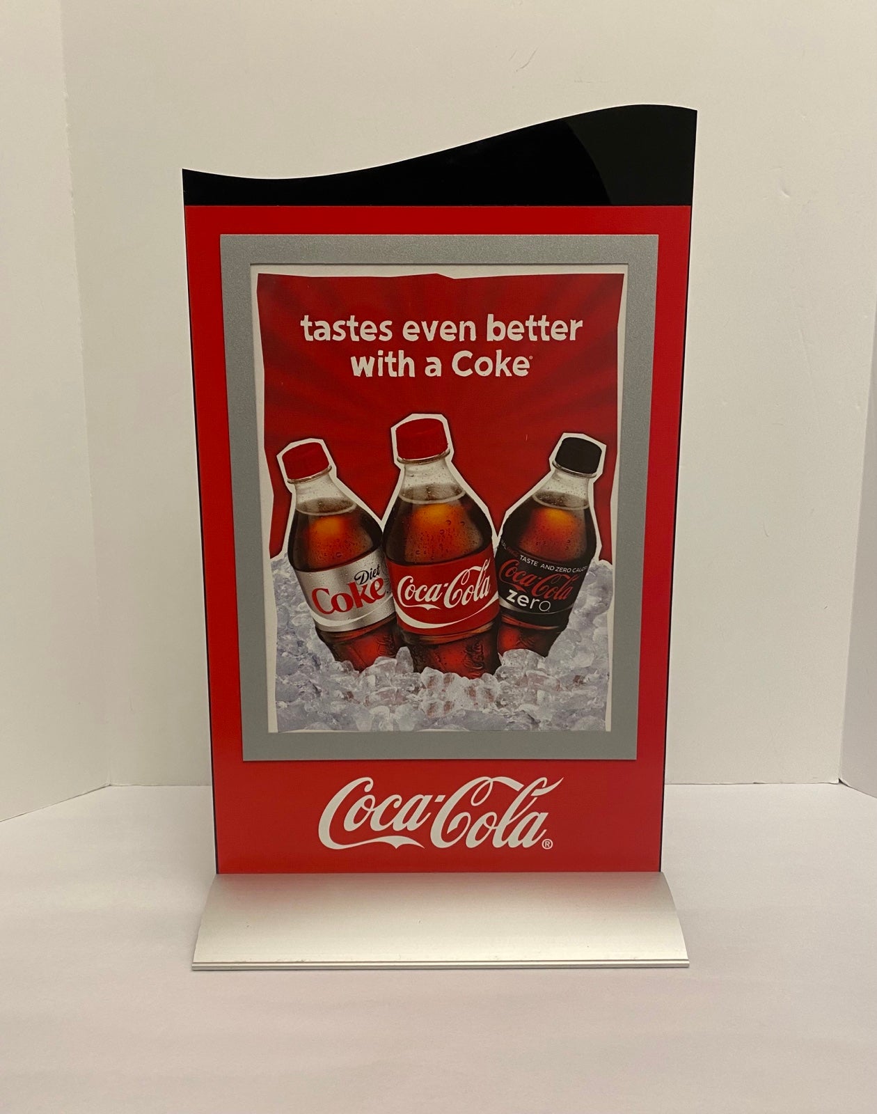 Coca-Cola 18.5” Happiness To Go Plastic Counter Sign With Metal Base.