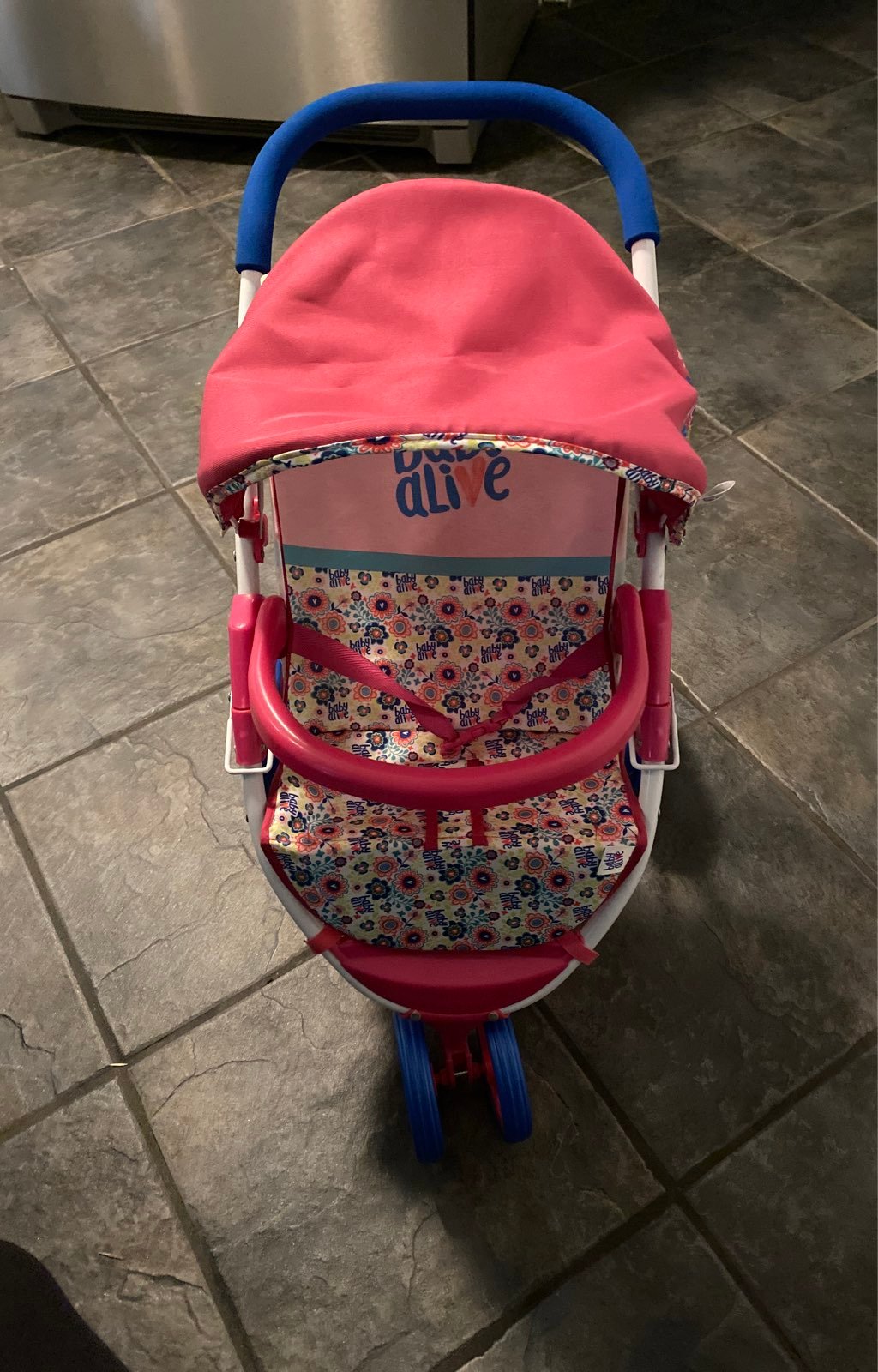 Pink baby alive stroller