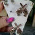 Crossed guns concho