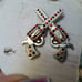 Crossed guns concho