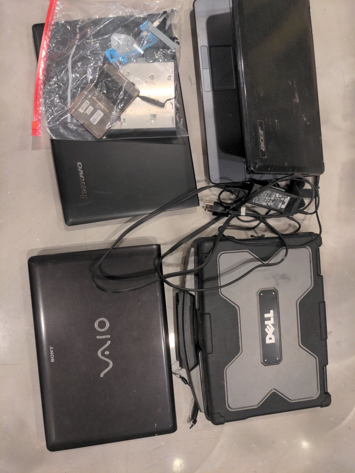 4 laptops. For repair. 2 boot, 1 is partly taken apart but works , 1 dead