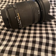 Sigma DC 18-250mm 1:3.5-6.3 HSM for Sony. Lens covers on both sides. Some wear