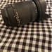 Sigma DC 18-250mm 1:3.5-6.3 HSM for Sony. Lens covers on both sides. Some wear