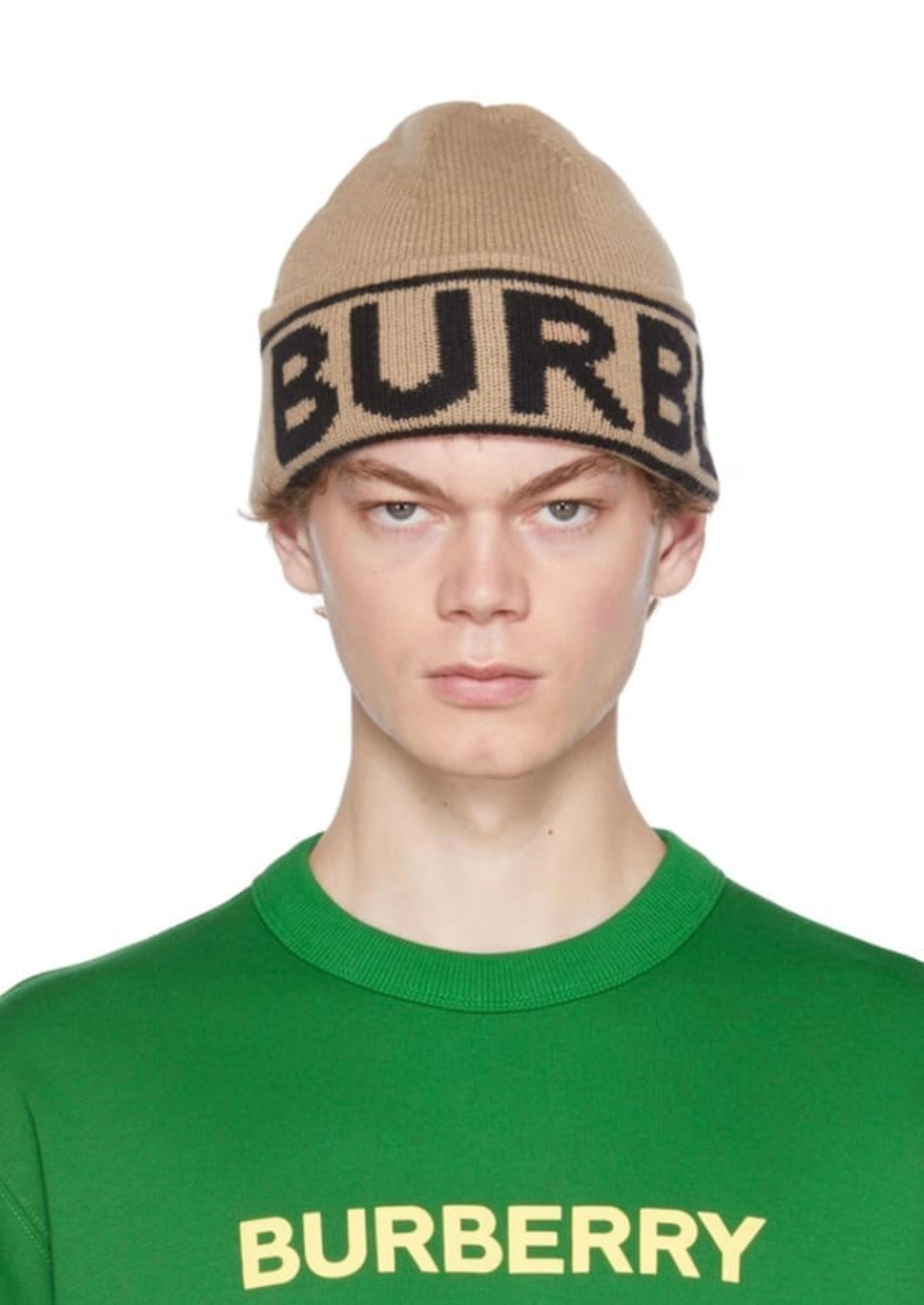 ITEM INFO Knit cashmere beanie in beige. Intarsia logo in black at rolled brim.
