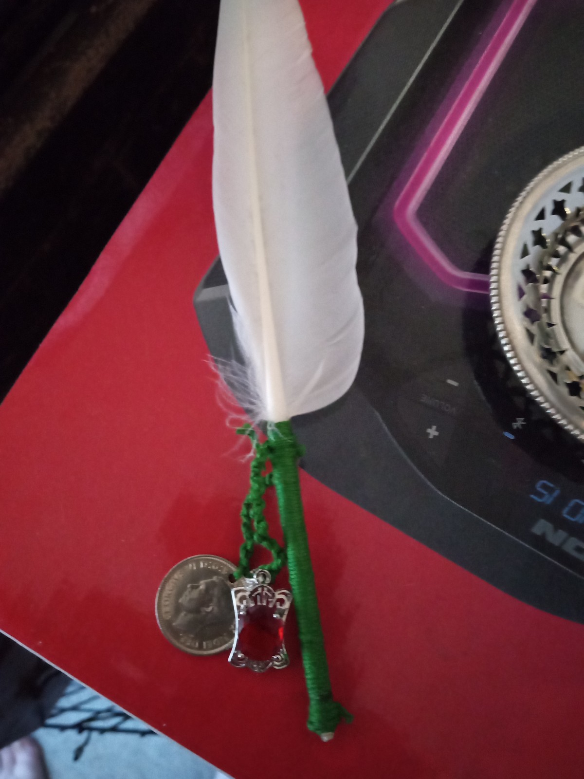 Cursed feather wealth charm