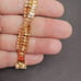 B307 Two Strand Criss Cross Champagne Tennis Bracelet. 7”.
