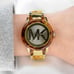 Women’s Gold Michael Kors clasp band style watch with tortoise shell details