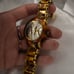 Women’s Gold Michael Kors clasp band style watch with tortoise shell details