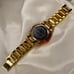 Women’s Gold Michael Kors clasp band style watch with tortoise shell details