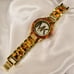 Women’s Gold Michael Kors clasp band style watch with tortoise shell details