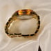 Women’s Gold Michael Kors clasp band style watch with tortoise shell details