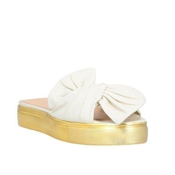Revolve Charlotte Olympia Ivory and Gold Leather Knotted Bow Sandals