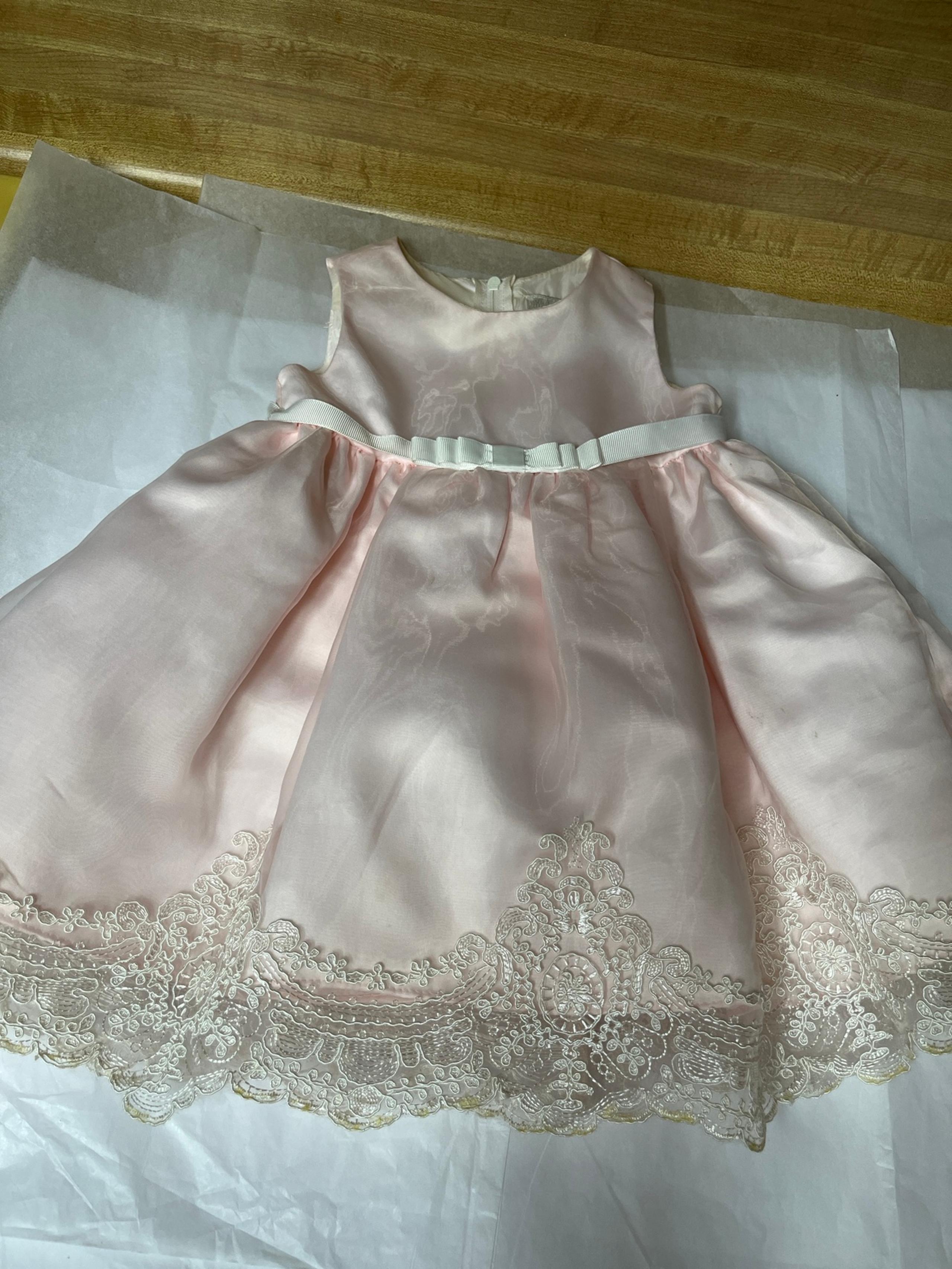 Rare Editions size 12 month dress is stunning! I would say it’s NWOT it’s pastel