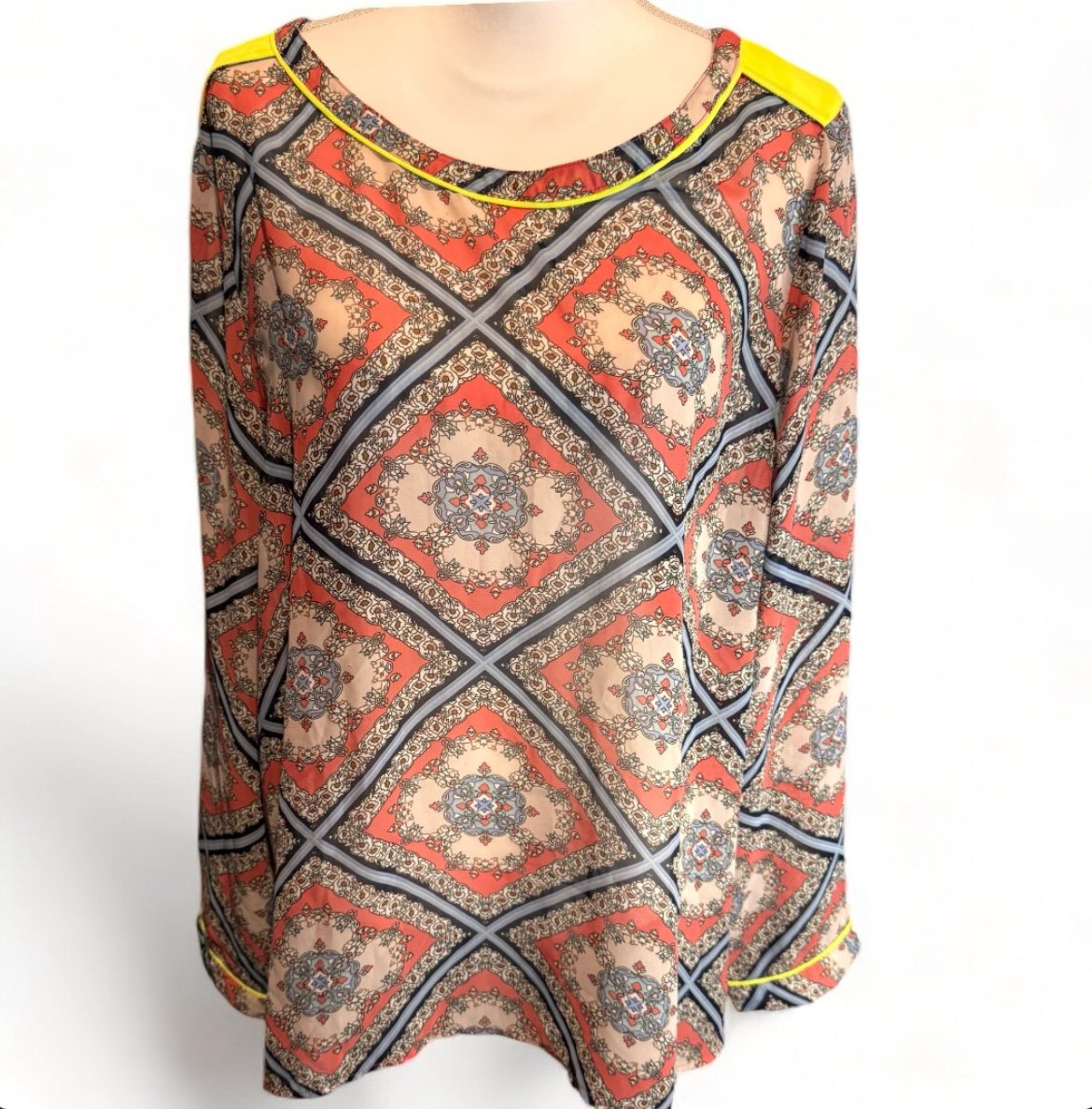 Discover the effortless charm of the Umgee Women's XL Blouse in a vibrant orange