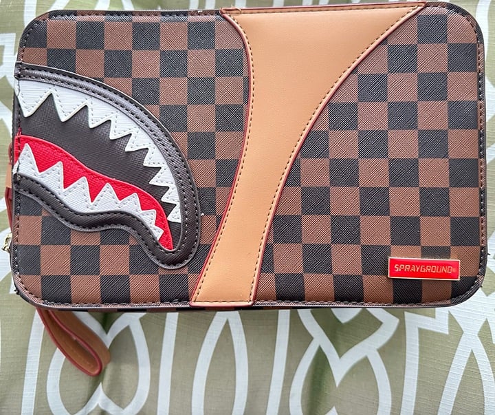 Sprayground Henny Air To The Throne Toiletry Kit.