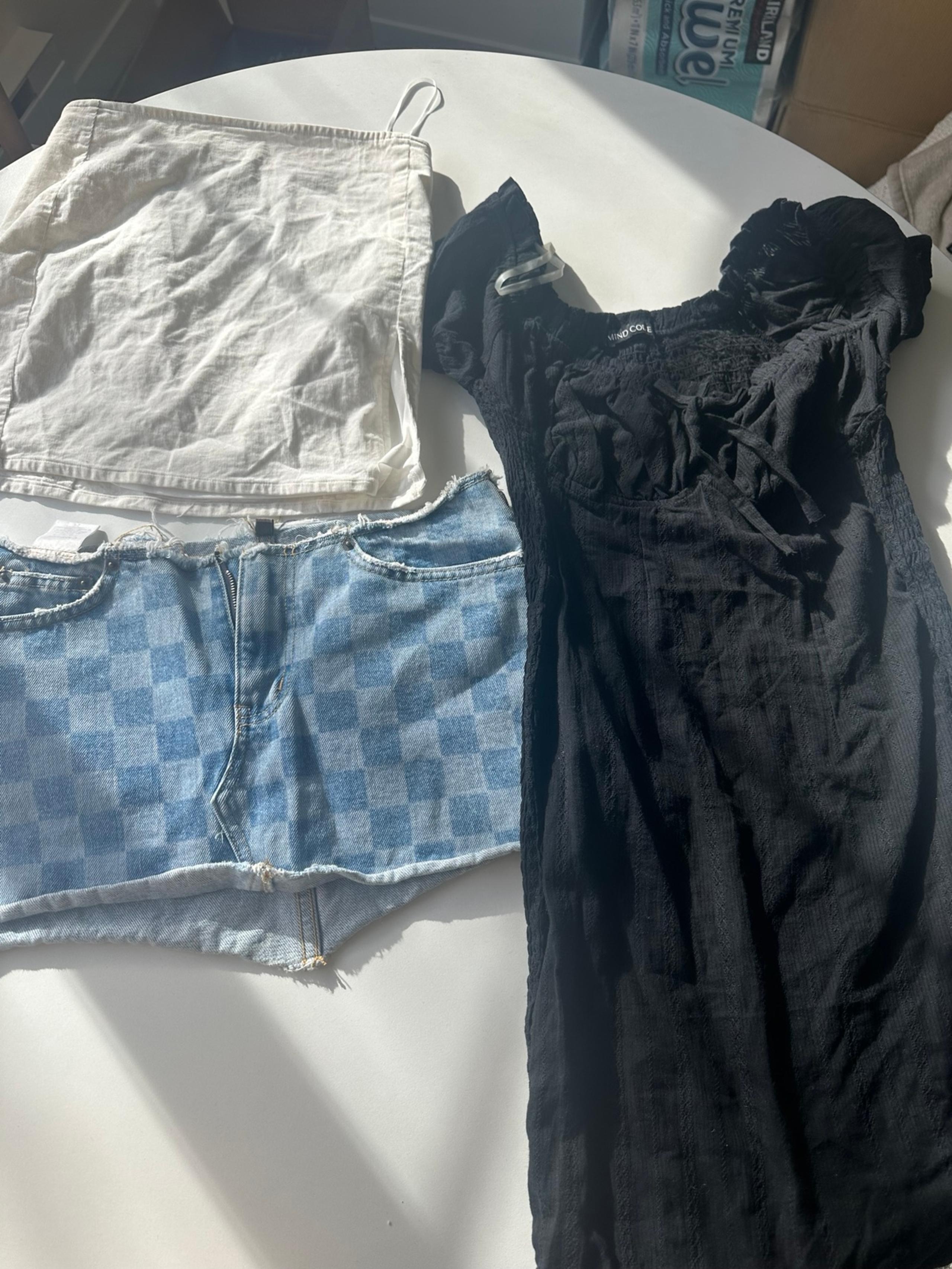 Two mini skirts and black mini dress