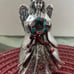 This Reed & Barton Silver Christmas 6 Angel Music Box plays Hark the Herald An