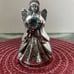 This Reed & Barton Silver Christmas 6 Angel Music Box plays Hark the Herald An
