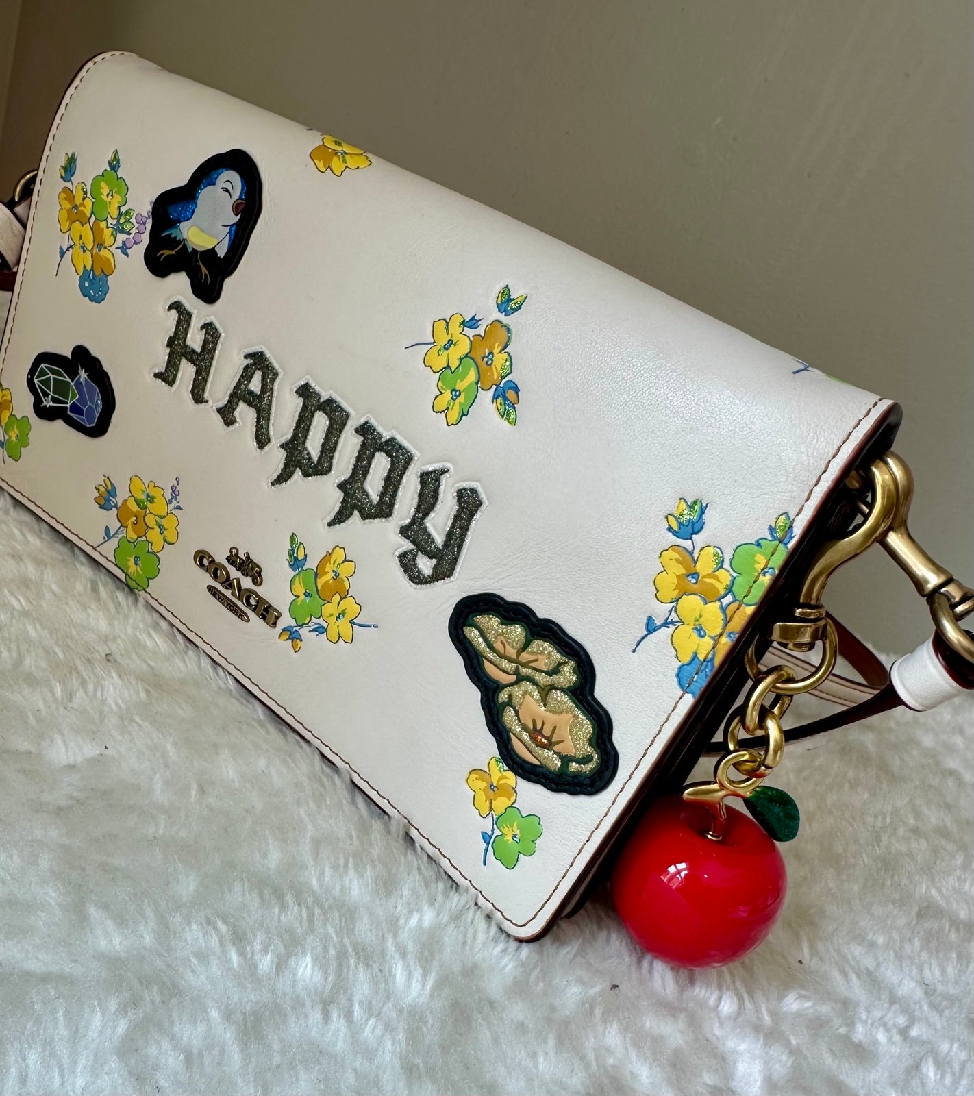 Coach Disney Dark Fairy tale Happy with Apple charm.