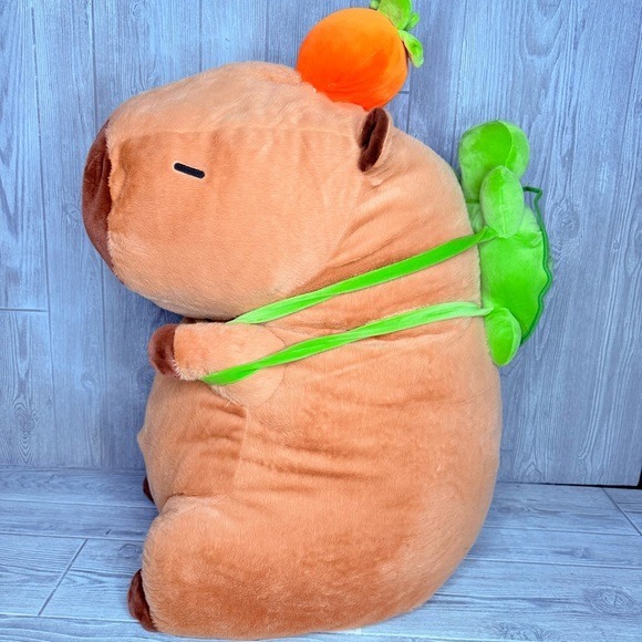 Nwot Giant capabara plush with back pack and orange on its head