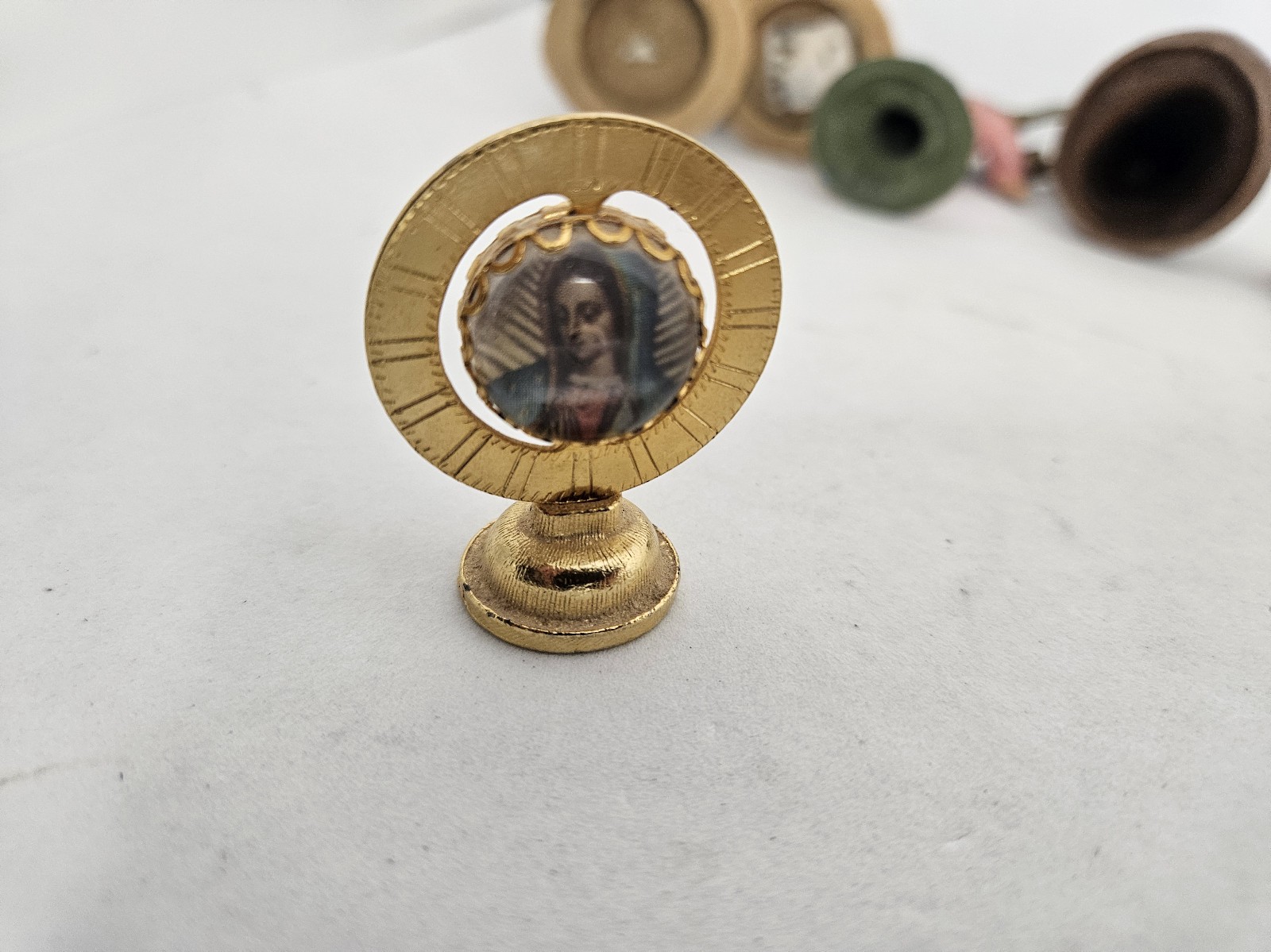 Vintage Catholic Icon Dash Magnet Globe Shaped Gold Color Used Condition Cool.
