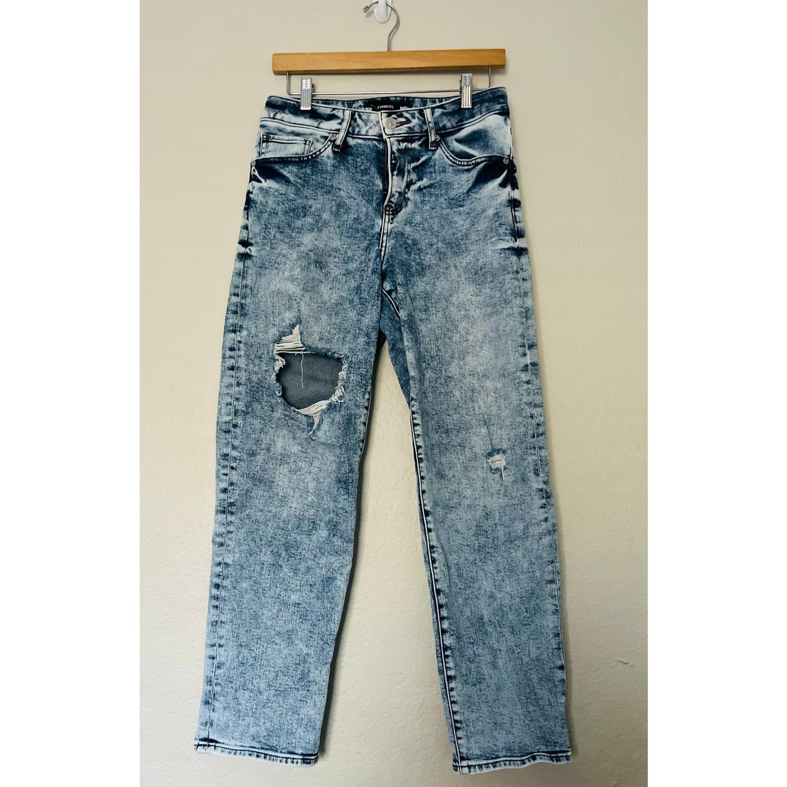 Express woman’s jeans. Mid-Rise. Medium wash ripped Boyfriend jeans. Size 4