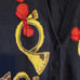 Vintage 90s French Horn Pattern Sleeveless Sweater Vest Black Gold Red
