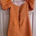 Autumn Adeigbo Orange Spot Liadan Floral Puff Sleeve Cutout Romper