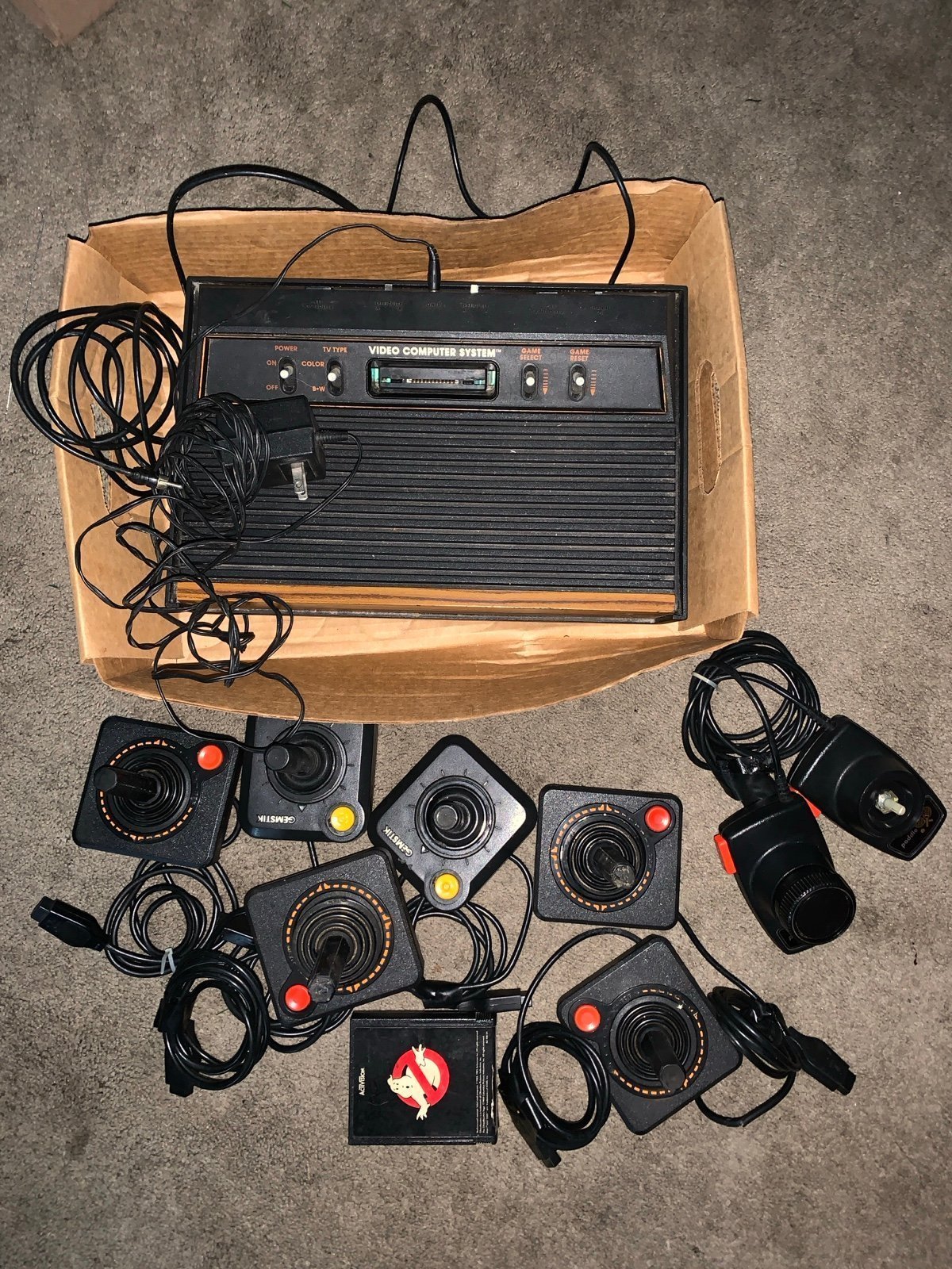 Vintage Atari console controls and Ghostbusters game