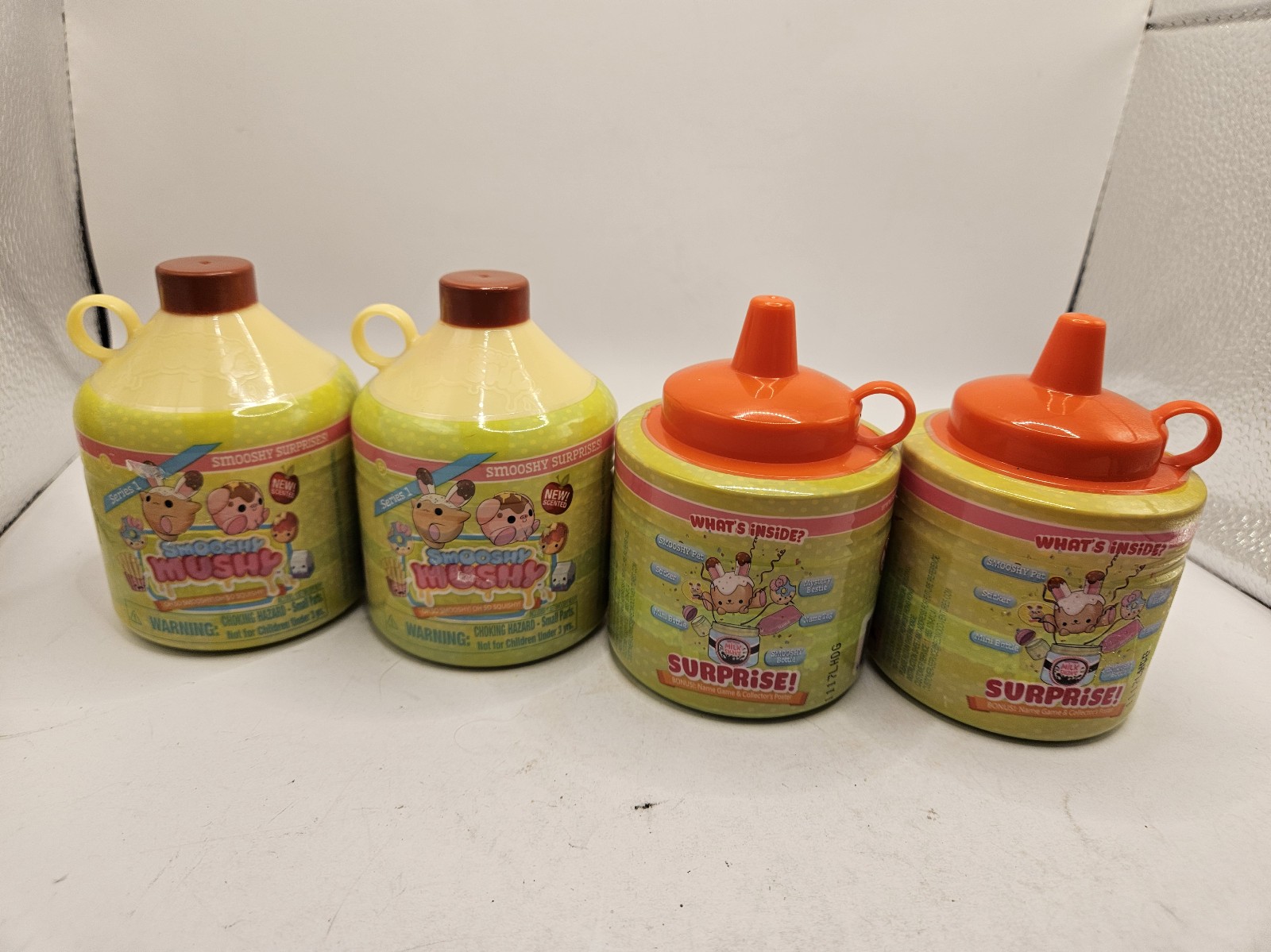 4 New Smooshy Mushy Series 1 Surprise 2 Ketchup And 2 Jug New And Sealed.  Items