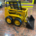 Ertl John Deere 569 Industrial loader Skid Steer 1/16 Diecast yellow Collectible