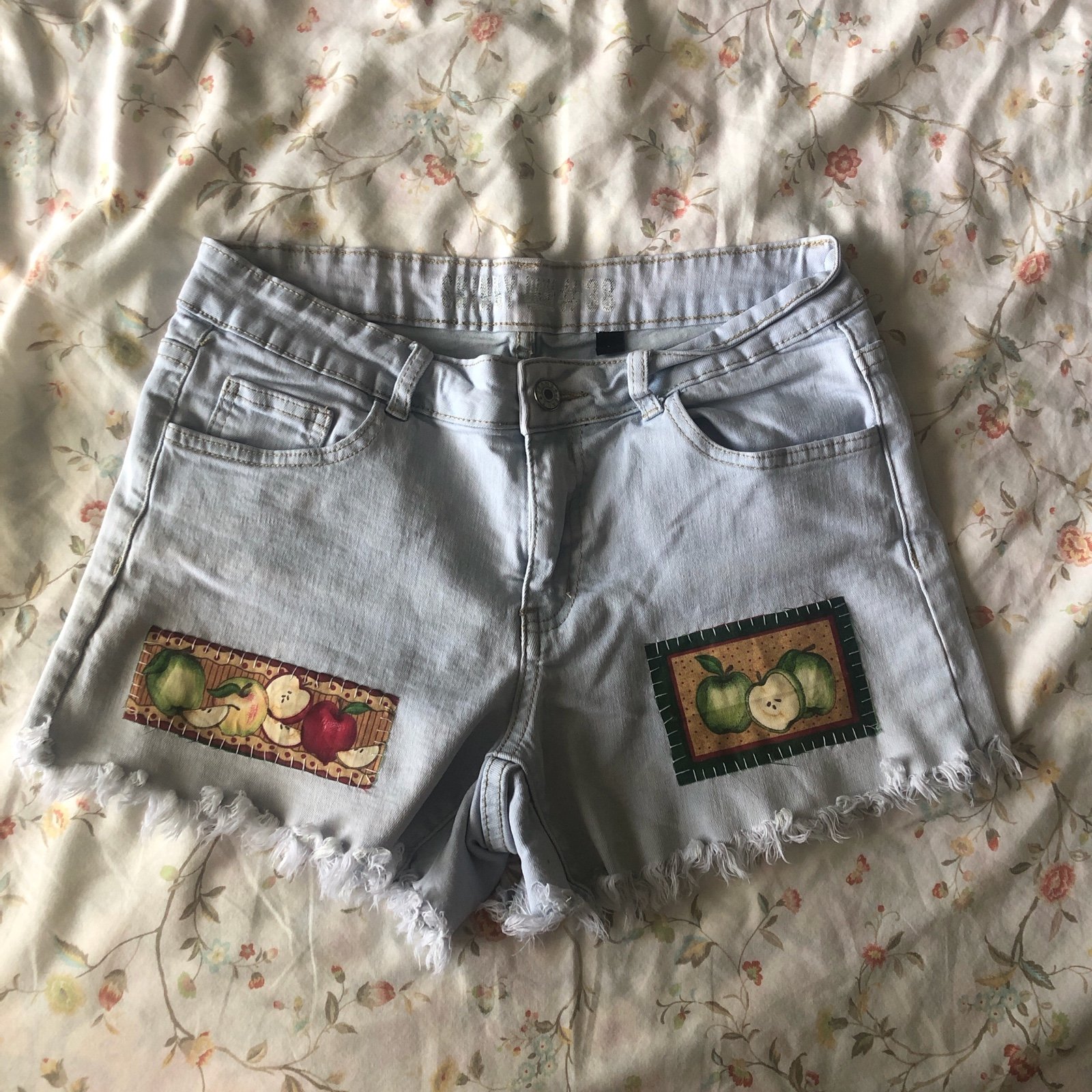 Upcycled denim shorts with cute apple patches