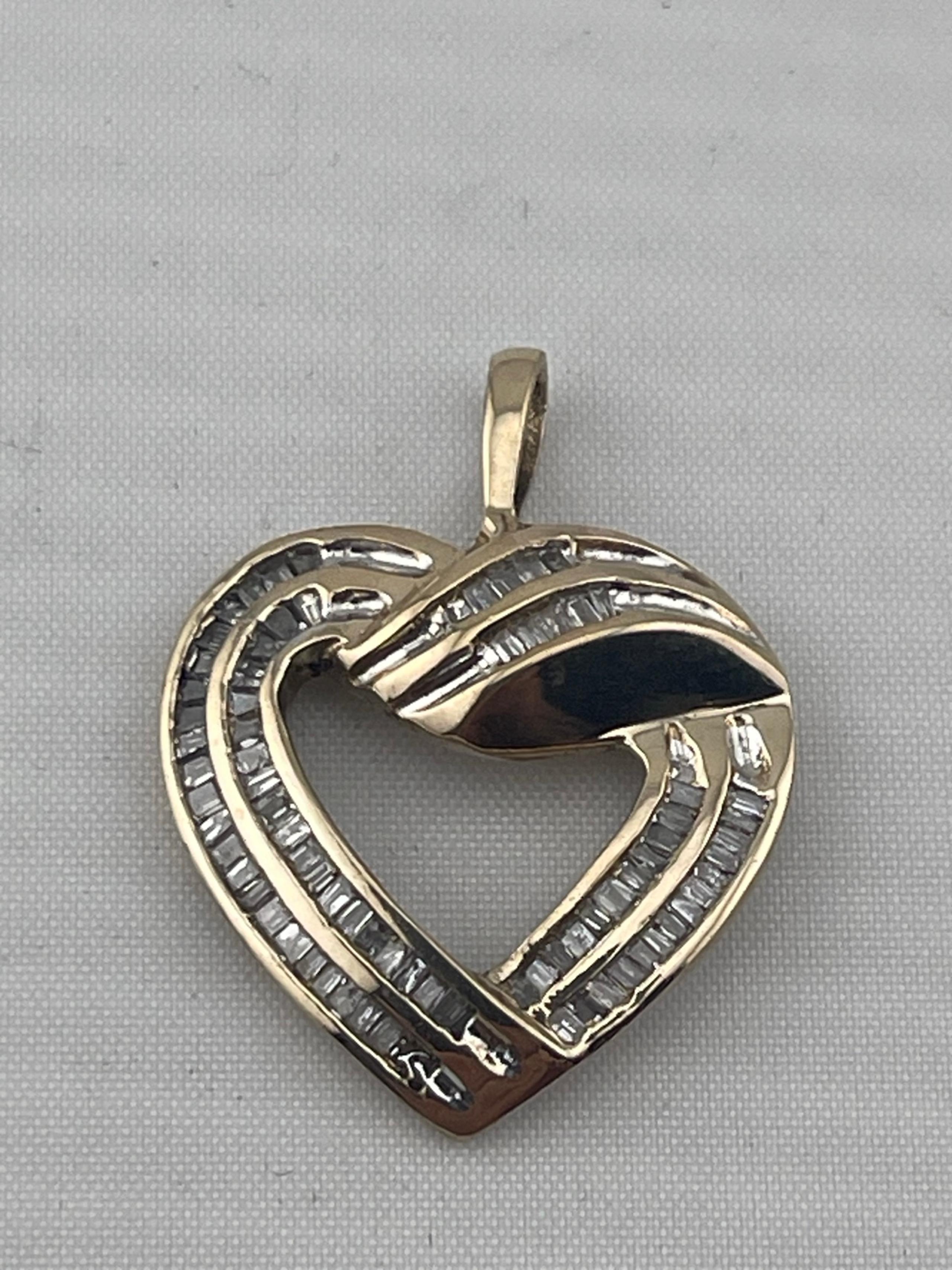 Vintage three-quarter carat, baguette, diamond heart pendant, 14kt yellow gold