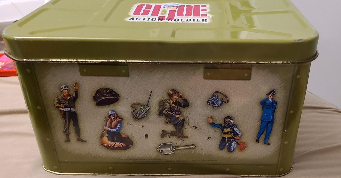 Gi joe box and figure with a lot of clothing boots and accessories and guns