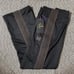 Straight, black, brown needles track pants.