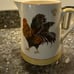 Rooster figurine and rooster pitcher