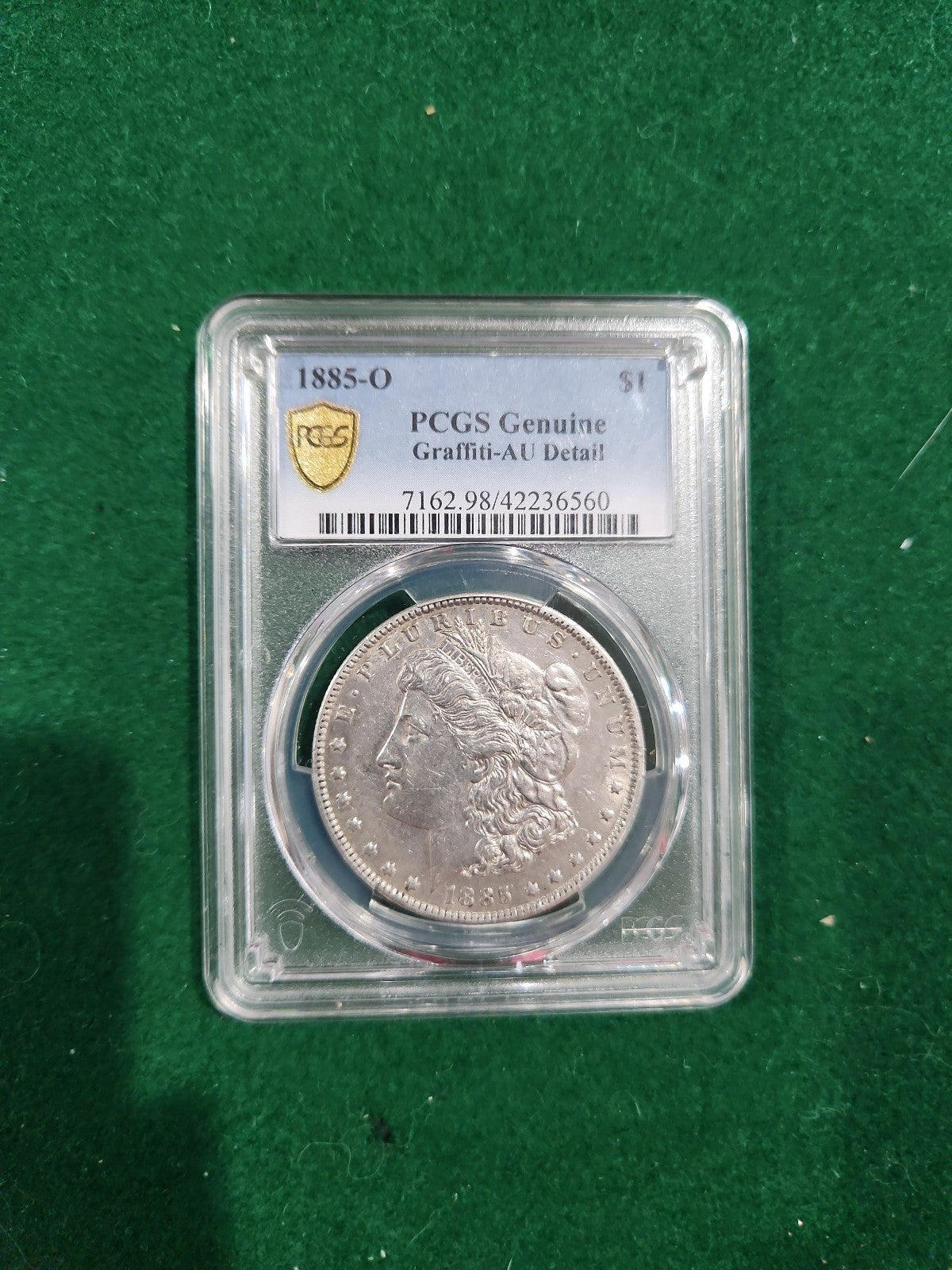 1885-O Morgan Silver Dollar PCGS Genuine Graffiti AU Detail