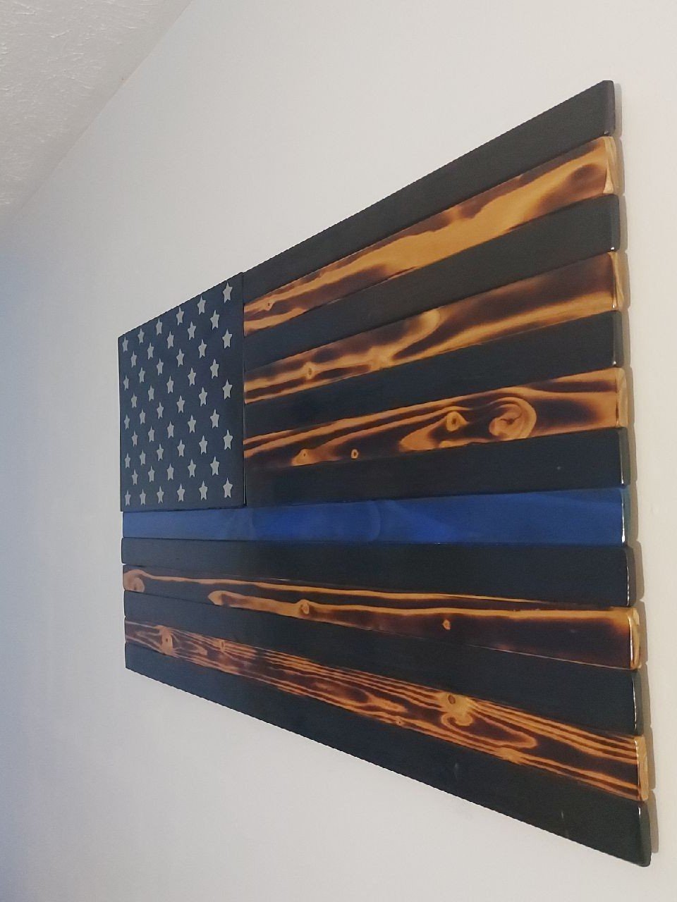 Large back the blue wooden flag