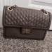 Karl Lagerfeld beige crossbody chain bag.