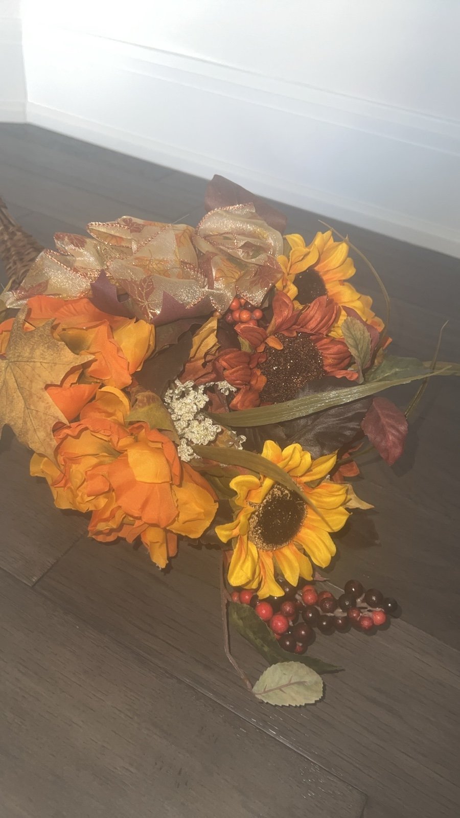 Cornucopia horn shaped wicker basket filled with flowers