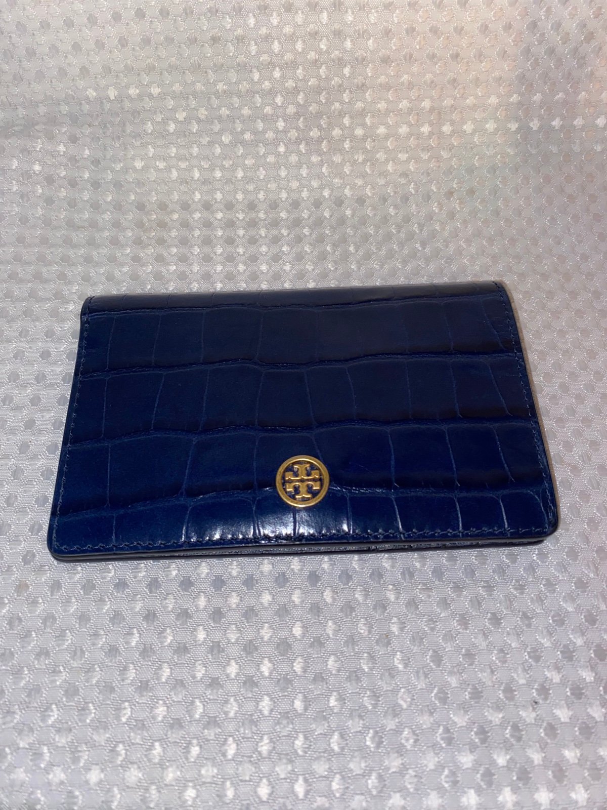 Tory Burch croc embossed leather wallet.