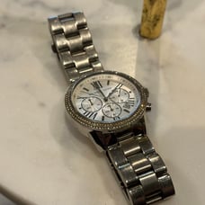 MK woman’s chrome watch