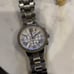 MK woman’s chrome watch