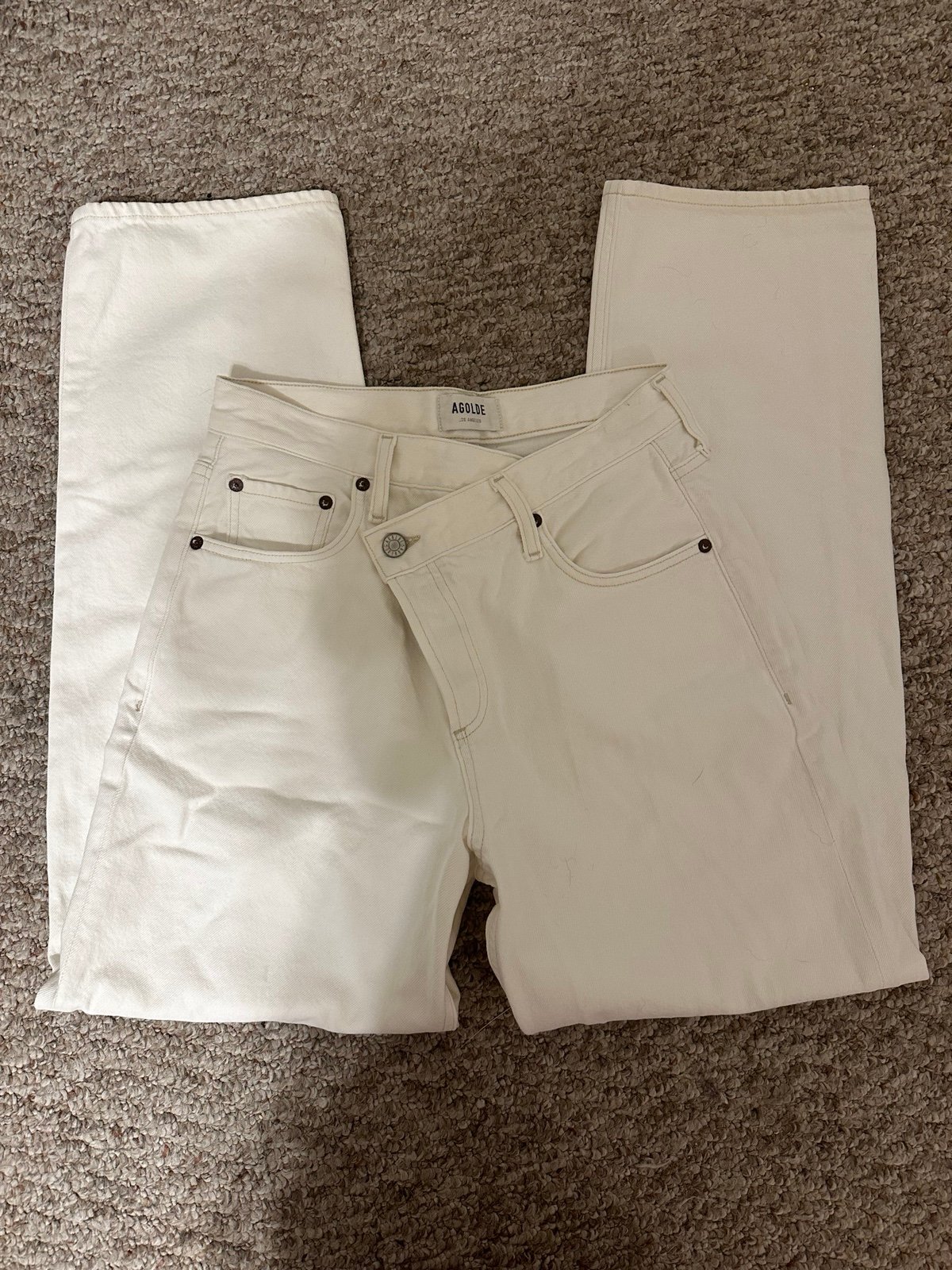 AGOLDE white cross over jeans