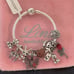 Linx Snake Chain Bracelet with Skull and Voodoo Doll Themed Charms