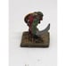 Sword wielding orc warlord with shield on stone slate spare game piece home deco