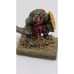 Sword wielding orc warlord with shield on stone slate spare game piece home deco