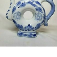 Vintage donut shaped porcelain tea pot
